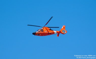 U.S Coast Guard Helicopter doing a patrol flyover the beach