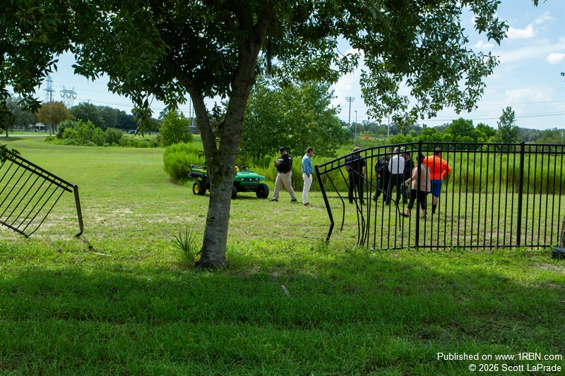 Damaged metal fence