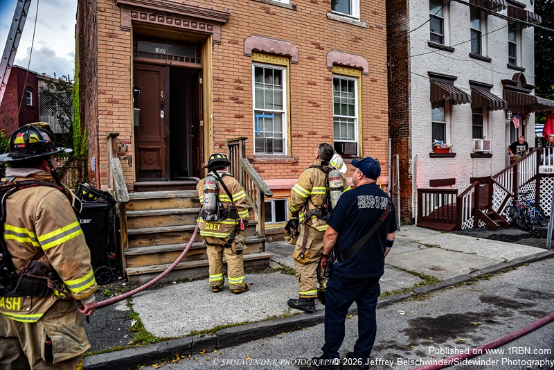Troy Firefighters Outside The Front Door Waiting For The Crew In The Basement To Switch Out