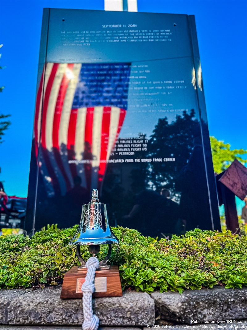 The American Flag Reflecting Off The 9.11 Monument In Troy NY