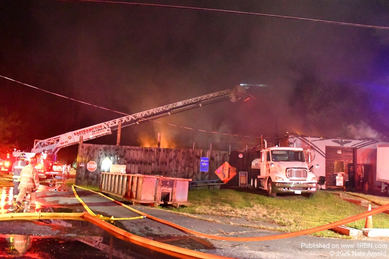 Easthampton Ladder 1 on the Bravo side, darkens down the last of the visible fire.