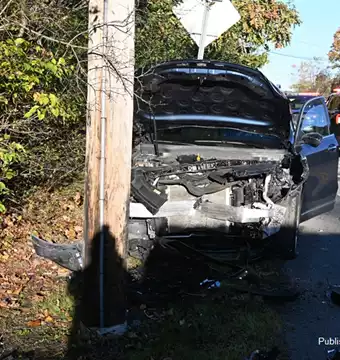 Two vehicle MVA veh strikes pole injuries