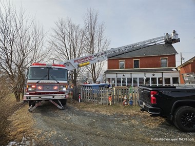 Tower 65 of the Pennsburg Fire Company on the scene of a dwelling fire