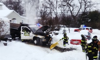 Snowplow catches fire in Woodland Park during storm