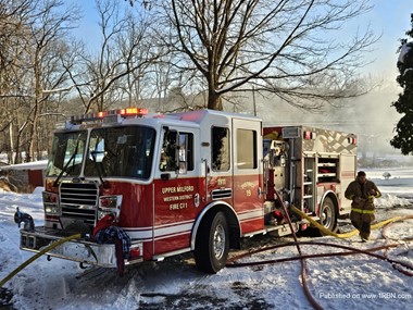 Rescue engine 19 in service at a dwelling fire in Upper Milford Township