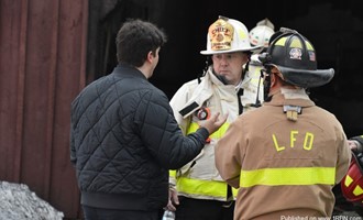 Recruit Firefighter Spots Garage Fire: Helps Residents to Safety