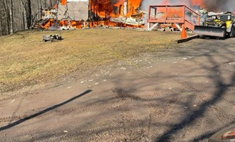 Firefighters Overcome Difficult Terrain to Control House Fire