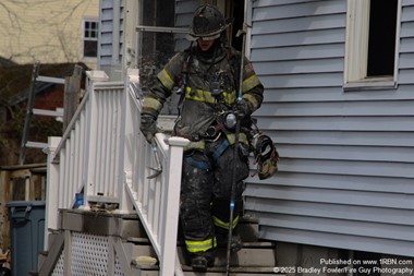 Firefighter operates at a private dwelling fire