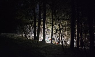 Emergency Crews Conduct Nighttime Remote Rescue After Snow Sliding Accident in Burke