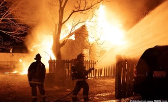 Detroit firefighters stretch on a vacant dwelling 