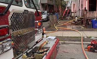 Firefighters Rescue Multiple Pets While Battling Clutter-Filled House Fire