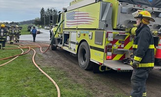 Shed fire extends to residence