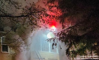 Multiple Alarms Sounded as Crews Battle Attic Fire in Multi-Unit Home
