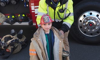 Orange Firefighters Talk About Safety with Kids, Show Them Equipment