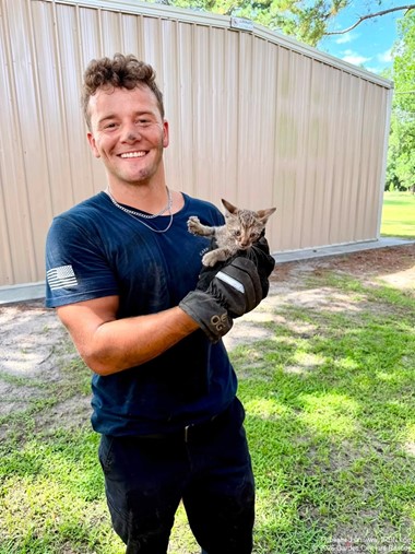 Firefighters Rescue Cat Trapped in Vehicle Engine Compartment