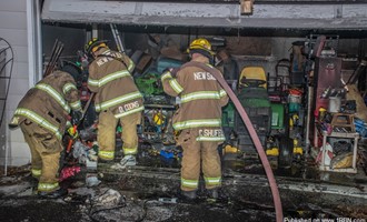 Fire Chief Extinguishes Garage Fire With Fire Extinguisher