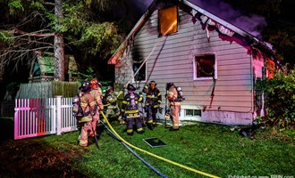 Fire Through The Roof of A Home In The West Crescent Fire District