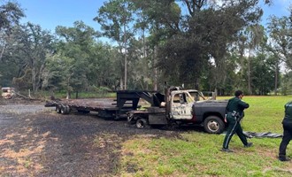 Brush Fire Extends to Vehicle; Crews Prevent Further Spread