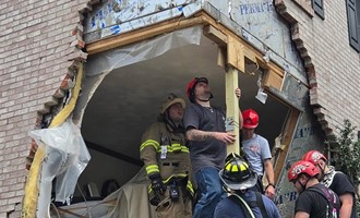 Mutual Aid Crews Assist at Overturned Vehicle into Structure