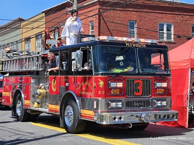 Elvis riding on engine 3 of the Elm Hill Hose Co. No.3 Plymouth