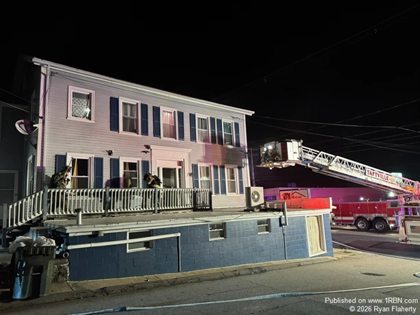 Engines 1 and 3 stretching a line to the second floor.