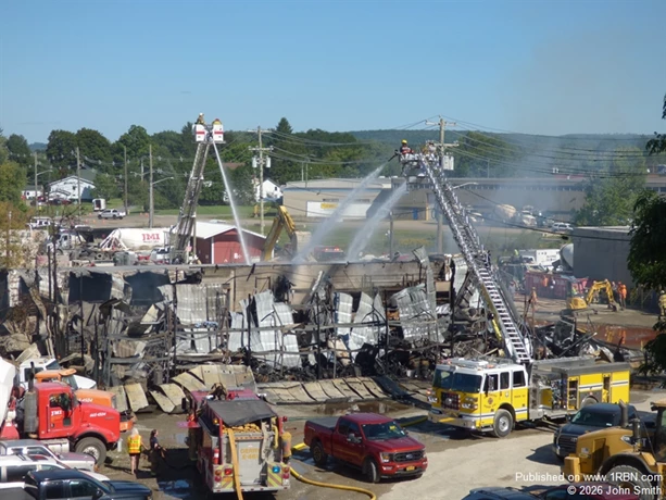 Firefighters watering down hot spots.