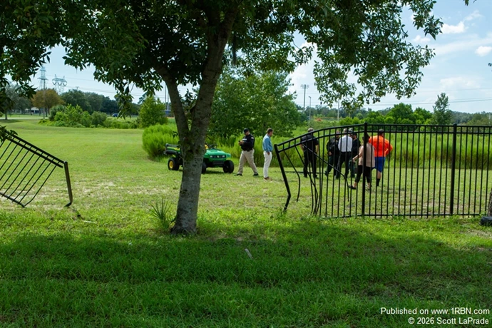 Damaged metal fence