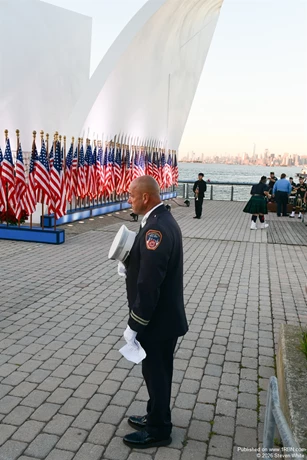 An FDNY member pays his respects.