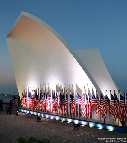 A photo of the Postcards 9/11 Memorial that faces NY Harbor and the World Trade Center. Profiles of all the Staten Islanders lost are etched in stone inside the memorial. 