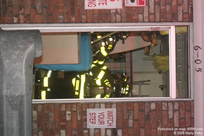 Crews Opening up Wall  in Adjacent UPS Store
