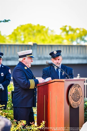 Retired Battalion Chief James Hughs Speaking The Crowd About What He Saw While Down At Ground Zero
