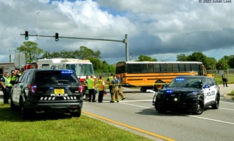Motorbike crashes into school bus