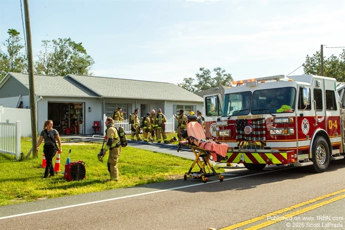 Firefighters outside of the knocked down fire.