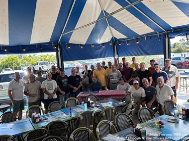 Elizabeth Fire Officers sign 9/11 memorial flag