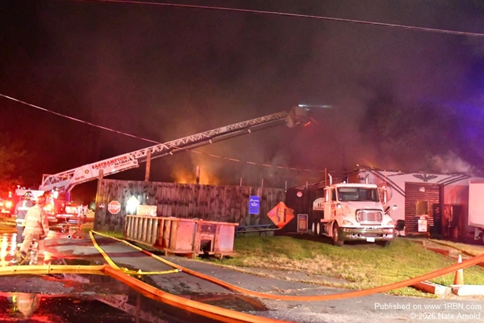 Easthampton Ladder 1 on the Bravo side, darkens down the last of the visible fire.