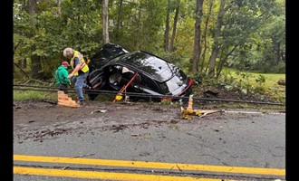 Firefighters Use Struts and Cribbing to Stabilize Car Trapped Under Downed Power Lines