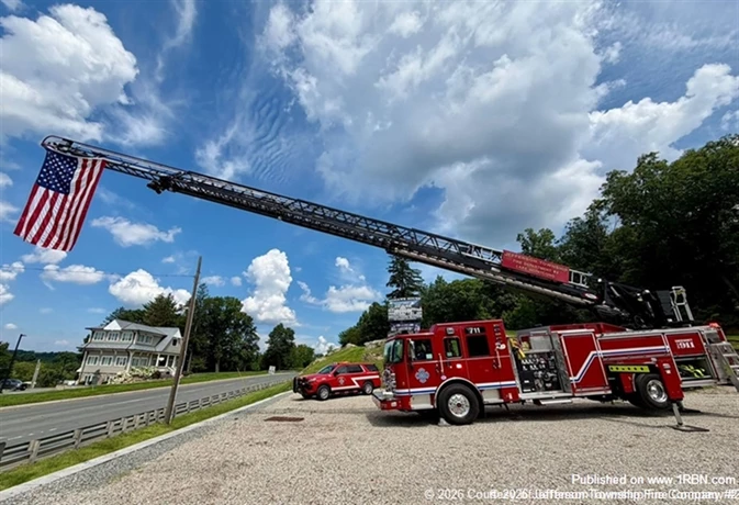 Jefferson Township Fire Company #2 displays the American flag from its aerial ladder in remembrance of the lives lost on September 11, 2001. The company joined fire departments and communities across the nation in observing the 25th anniversary of the attacks and honoring the 343 FDNY firefighters, 37 Port Authority Police officers, 23 NYPD officers and other first responders who made the ultimate sacrifice.