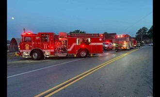 Heavy Fire Engulfs Two-Stall Garage and Threatens Occupied Home in Rochester