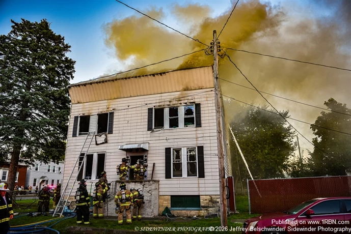 Heavy brown smoke pushing from the building on arrival