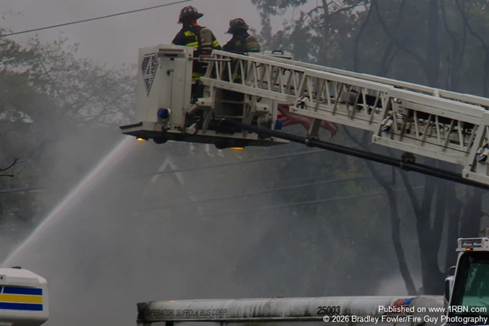 West Islip FD Ladder 3-17-4 in operation hitting the pile of vehicles