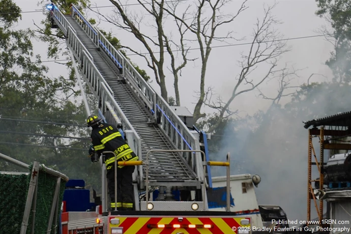 Bay Shore FD Ladder 3-1-7 master stream in operation hitting the pile of vehicles
