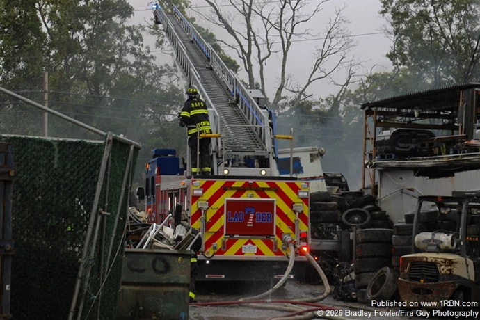 Bay Shore FD Ladder 3-1-7 master stream in operation hitting the pile of vehicles
