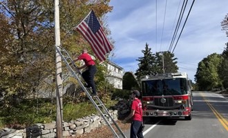Gilmanton Firefighters Prepare Flags for Winter Rest