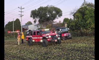 Brush 3 Advances Hose Line Through Residential Yard to Contain Spreading Field Fire