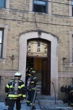 North Hudson firefighters advance a back-up line to a fire in a rear fourth floor apartment, on 44th Street, Union City, as the department