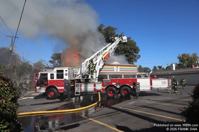 Heavy fire goes through the roof as Pennsauken Tower Ladder 11 works to control the heavily involved roof area at this All Hands fire at 6001 Westfield Avenue, Pennsauken, NJ on October 19, 2026.
