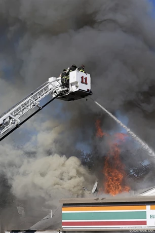 Pennsauken Tower Ladder 11 works to extinguish the heavy fire in the roof area of this All Hands fire at 6001 Westfield Avenue, Pennsauken, NJ on October 19, 2026.