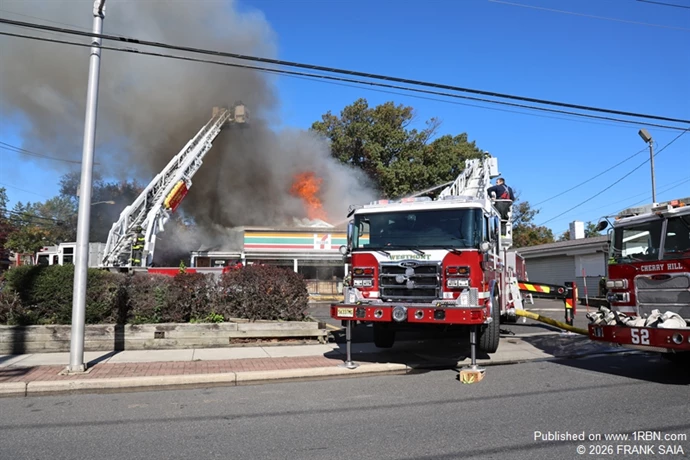 Pennsauken and Westmont tower ladders work to control the heavy fire in the roof area  at the All Hands fire at 6001 Westfield Avenue, Pennsauken, NJ on October 19, 2026.