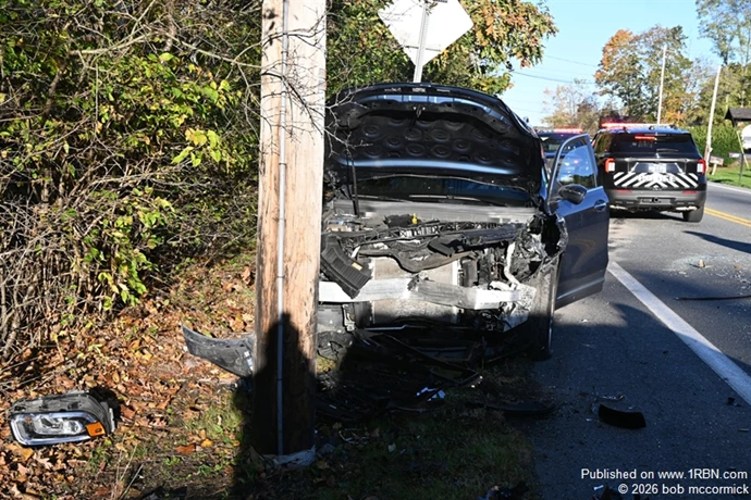 Two vehicle MVA veh strikes pole injuries