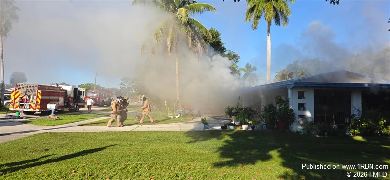 Fort Myers Fire Department crews work to extinguish a house fire on Moreno Avenue.
